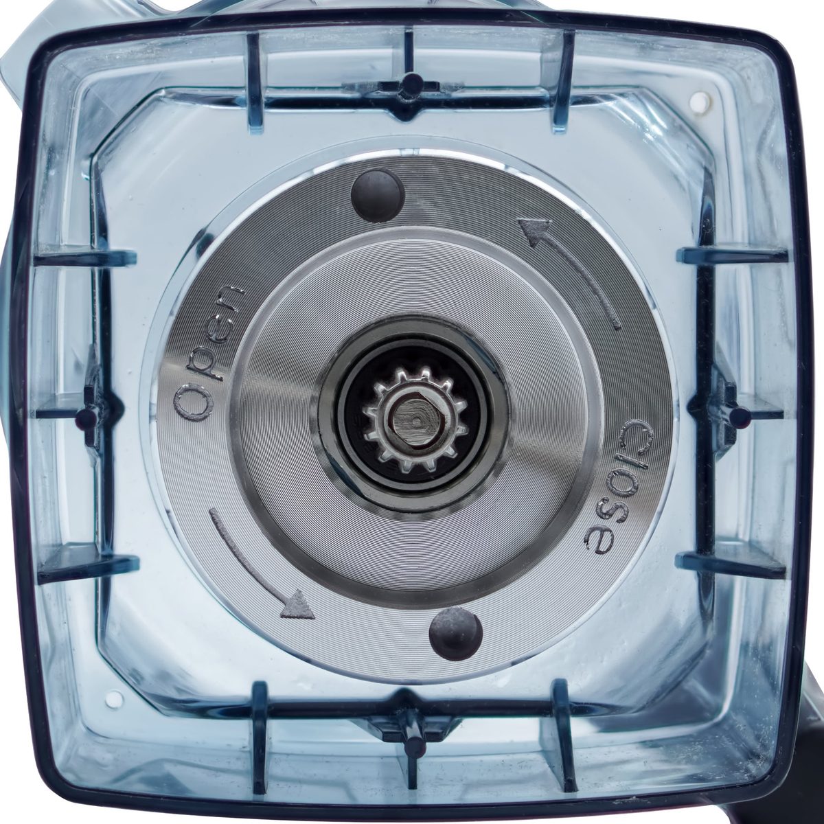 A close-up of a blender blade assembly seen through the jar base